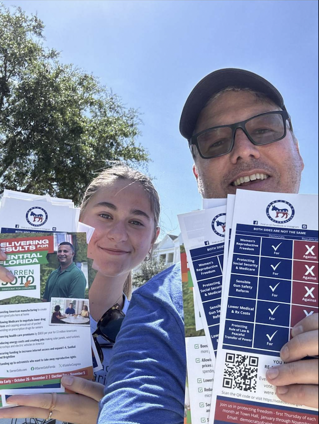 Senior Guadalupe Maggio (left) poses while canvassing for congressman Darren Soto. Maggio was hired by Soto's campaign at the beginning of the school year and also works at a local restaurant, Hinode Sushi.